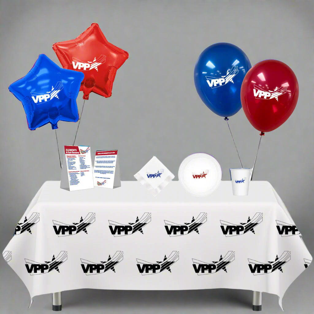 Table setup with balloons and cups featuring VPP logo on a white background