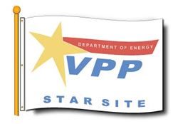 A flag with a white background featuring a yellow star and the text 'VPP STAR SITE' along with the Department of Energy logo.